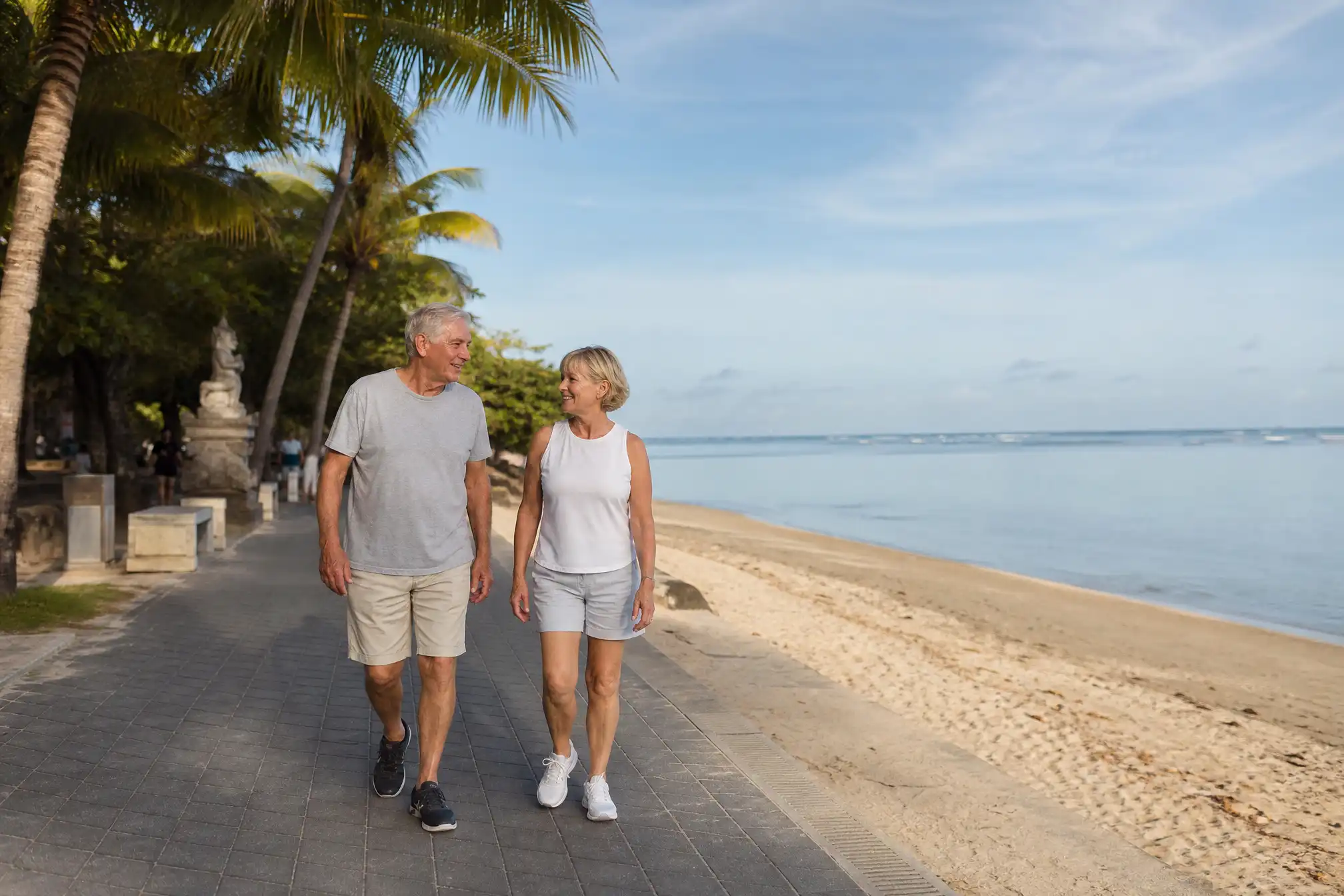 Australian retired couple at Sanur beach promenade in Bali