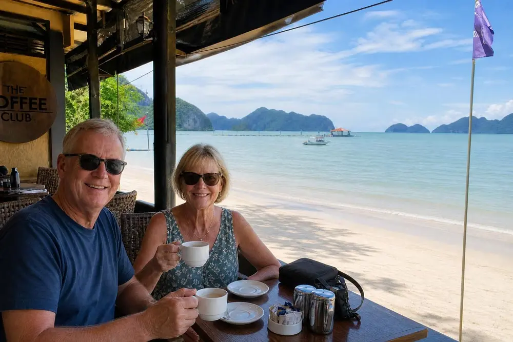 Australian retired couple relaxing at a Langkawi beachside cafe