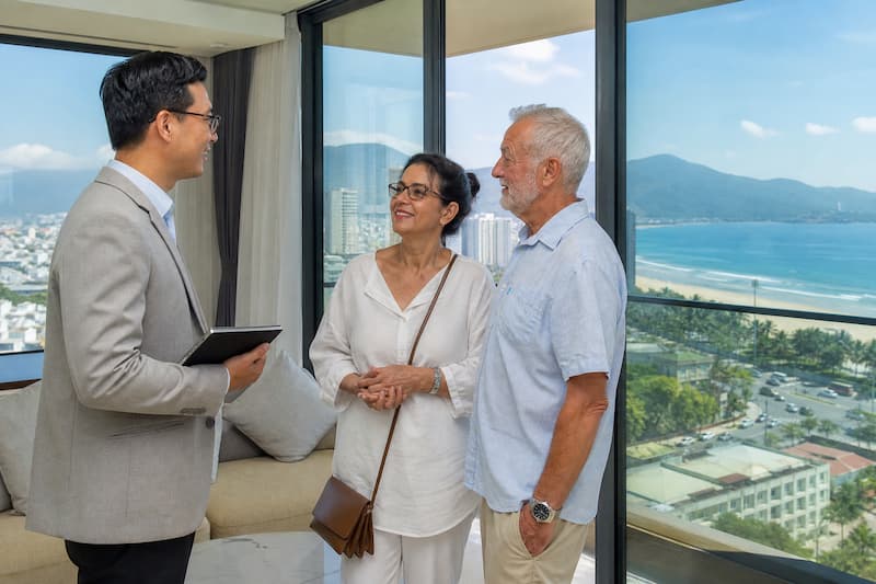 Australian retired couple viewing Da Nang condo with property adviser Vietnam